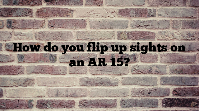 How do you flip up sights on an AR 15?